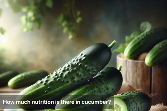 Fresh cucumbers stacked in a wooden basket on a table.